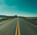 A long straight road with beautiful scenery